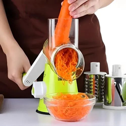 3-in-1 vegetable slicer with three stainless steel blades for slicing, grating, and shredding ingredients.
