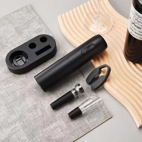 Electric wine opener with foil cutter for quickly removing bottle seals before opening wine.