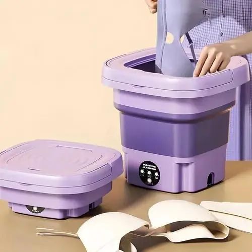 Foldable mini laundry washer with a compact design for easy storage when not in use.