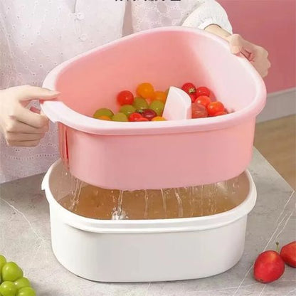 Hand crank fruit washer bowl designed to remove dirt from fruits and vegetables with ease.