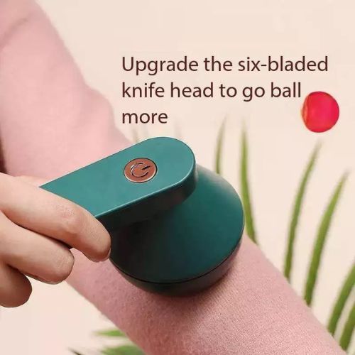 Handheld lint remover for fabrics with an ergonomic design for easy and comfortable garment care.