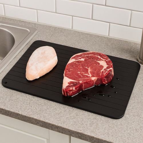 Natural meat thawing board designed to speed up defrosting without hot water or electricity.