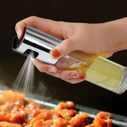 Olive oil mister sprayer designed for controlled and even application of oil during cooking and meal preparation.