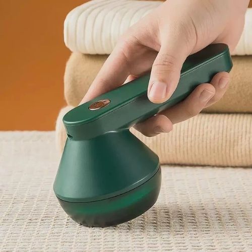 Rechargeable fabric shaver and lint remover for removing lint, fuzz, and fabric pills from clothing.