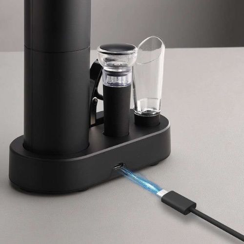 Wine opener set with drip-free pourer and vacuum stopper for convenient serving and wine preservation.